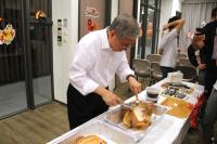 Prof Wai-Yee CHAN carving a roast turkey for the participants